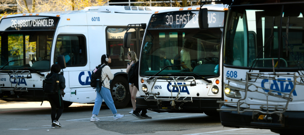 MSU students boarding CATA buses on campus