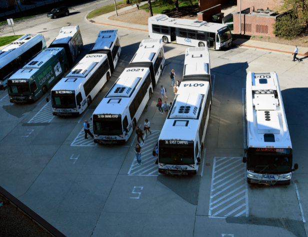 An overhead view of MSU Ramp 1 with multiple busses and students