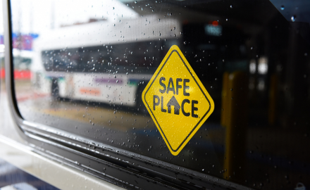 Safe Place icon with CATA bus reflection in bus window